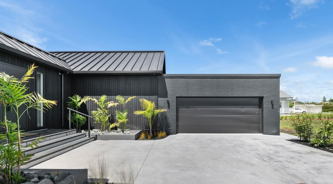 Black cedar and bagged-brick new build exterior at Mangawhai Estuary, painted by MH Painting